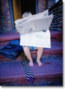 Colorado divorce law & Colorado divorce information - young boy reading the latest news!