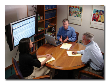 Image of Chris with couple using flat screen to consider divorce planning options in family mediation - ©, 2006